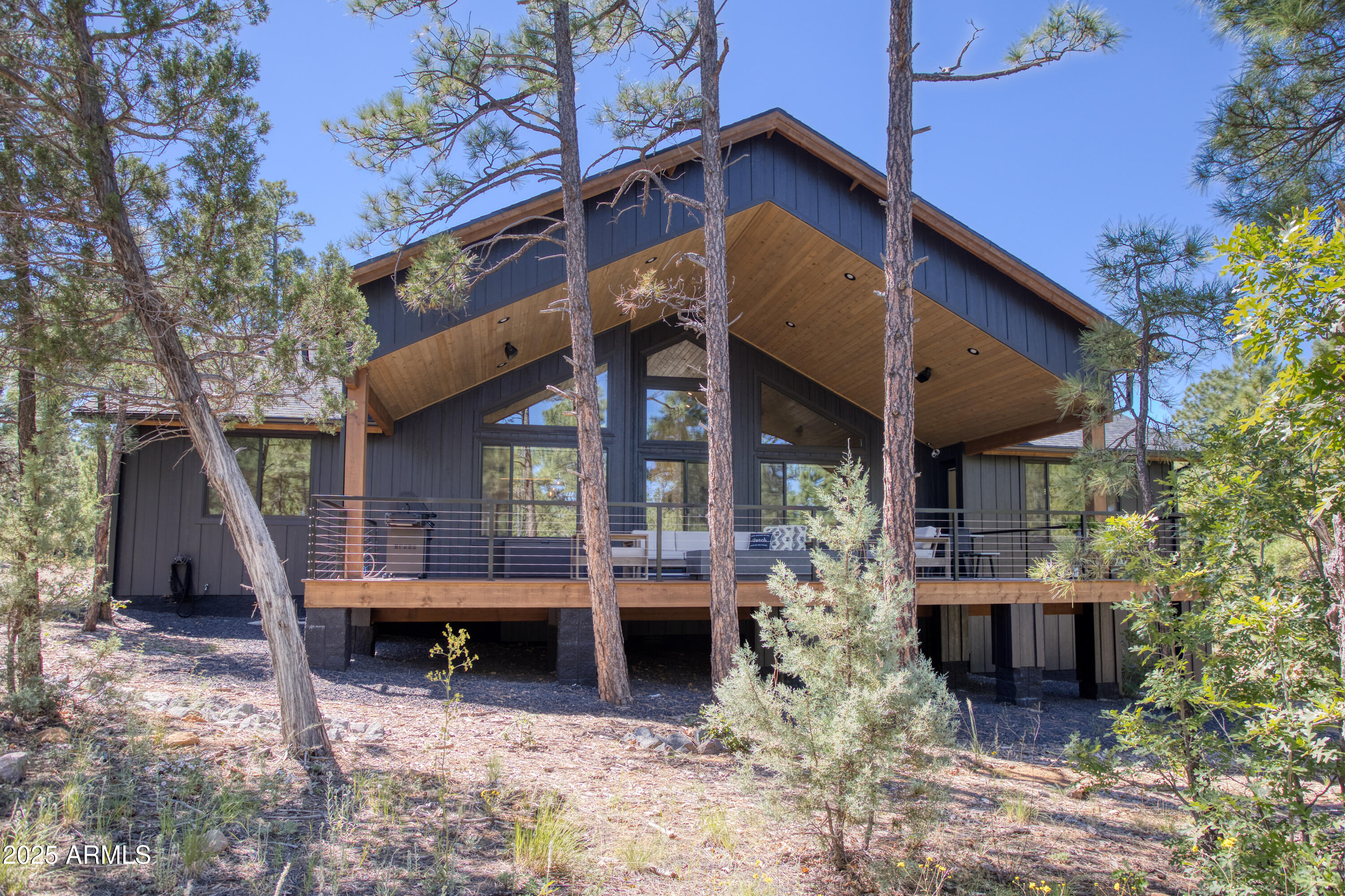 4500 West Hackberry Lane, Unit 161 Show Low, AZ 85901 - Photo 3 of 33 a view of a house with a balcony and wooden fence