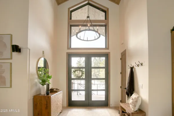 a view of a entryway with furniture and floor to ceiling window