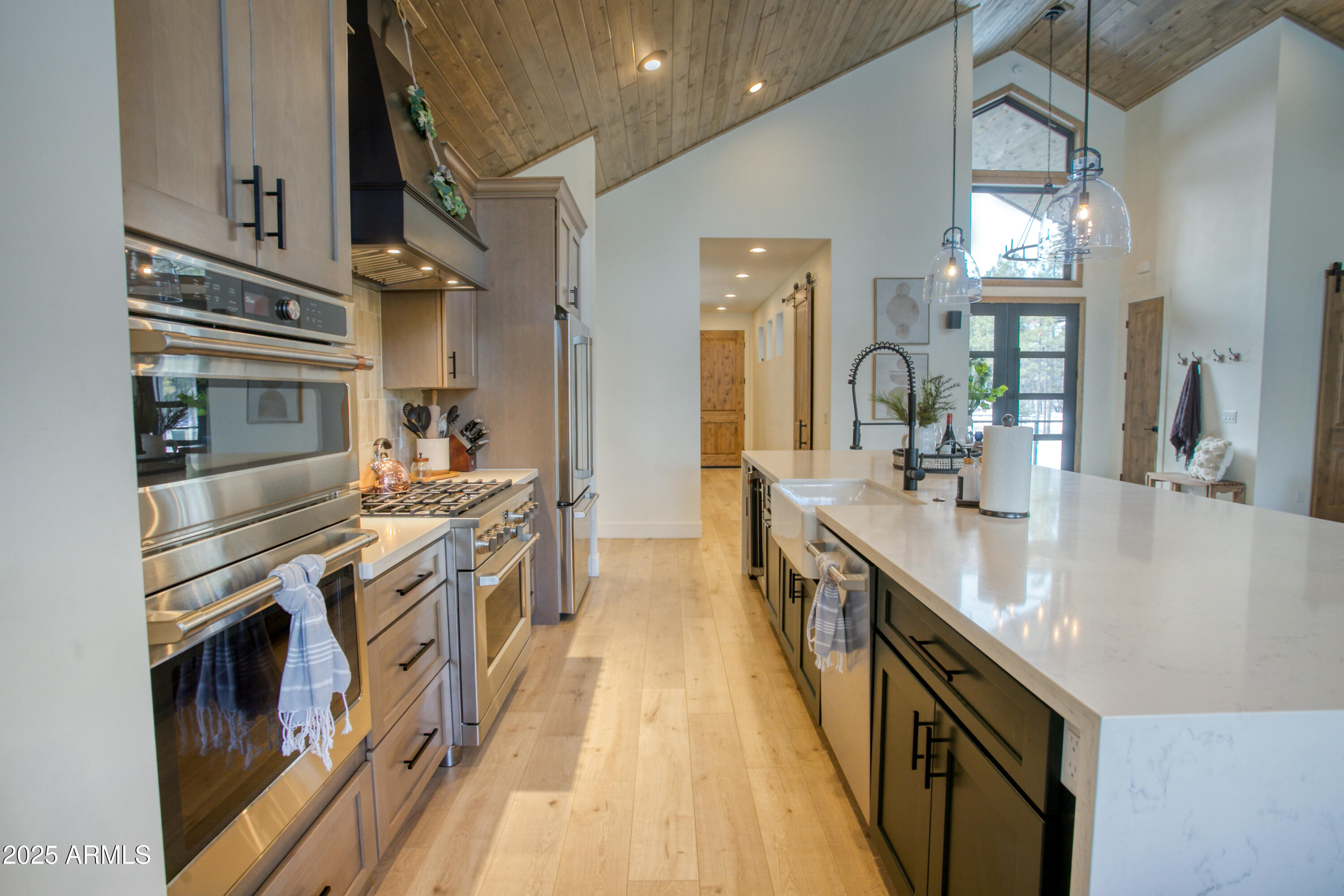 4500 West Hackberry Lane, Unit 161 Show Low, AZ 85901 - Photo 7 of 33 a kitchen with stainless steel appliances granite countertop lots of counter top space and wooden floor