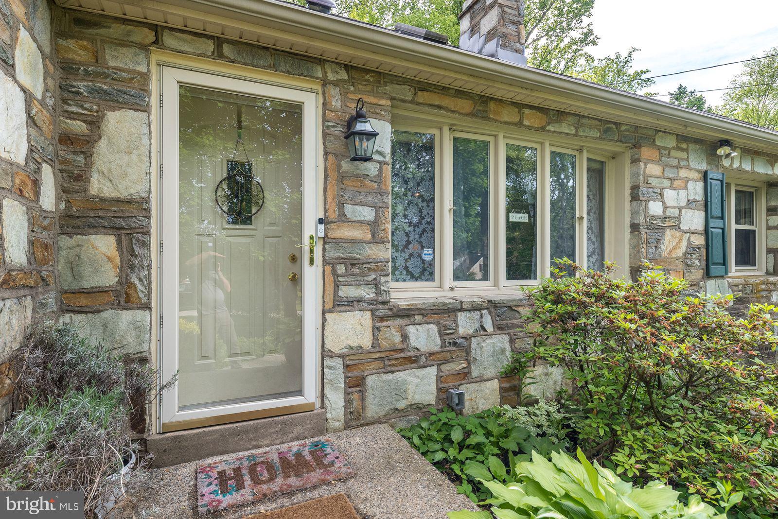 534 Pinney Road Huntingdon Valley, PA 19006 - Photo 4 of 26 front view of a house with a glass door