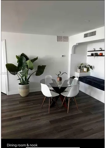 a view of a chairs and table on the deck