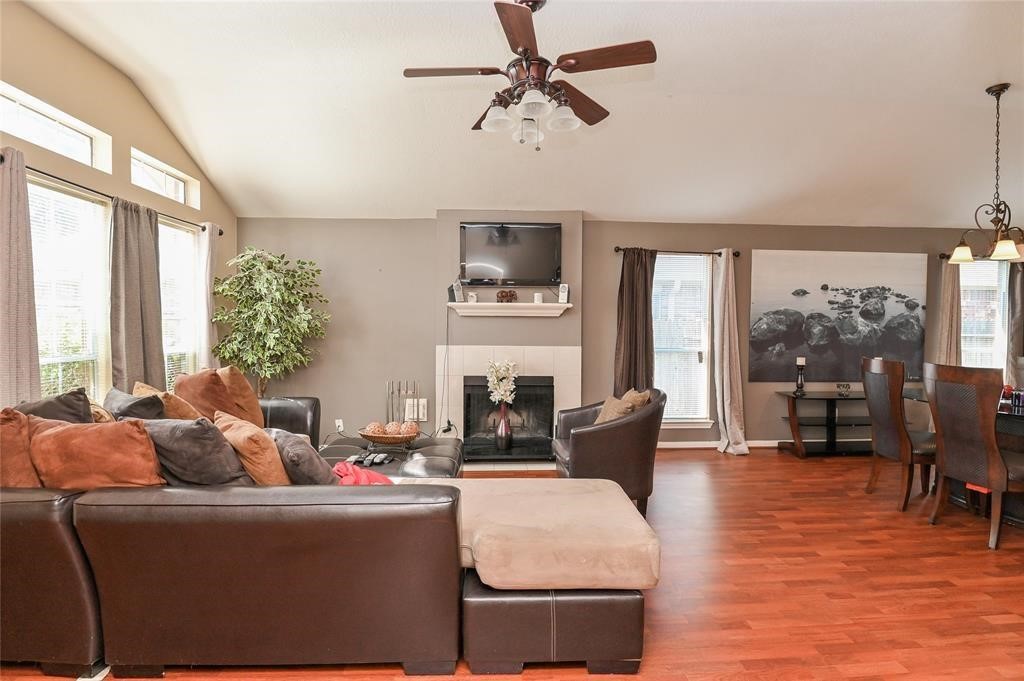 18446 South Wimbledon Drive Katy, TX 77449 - Photo 3 of 24 a living room with furniture fireplace and a large window