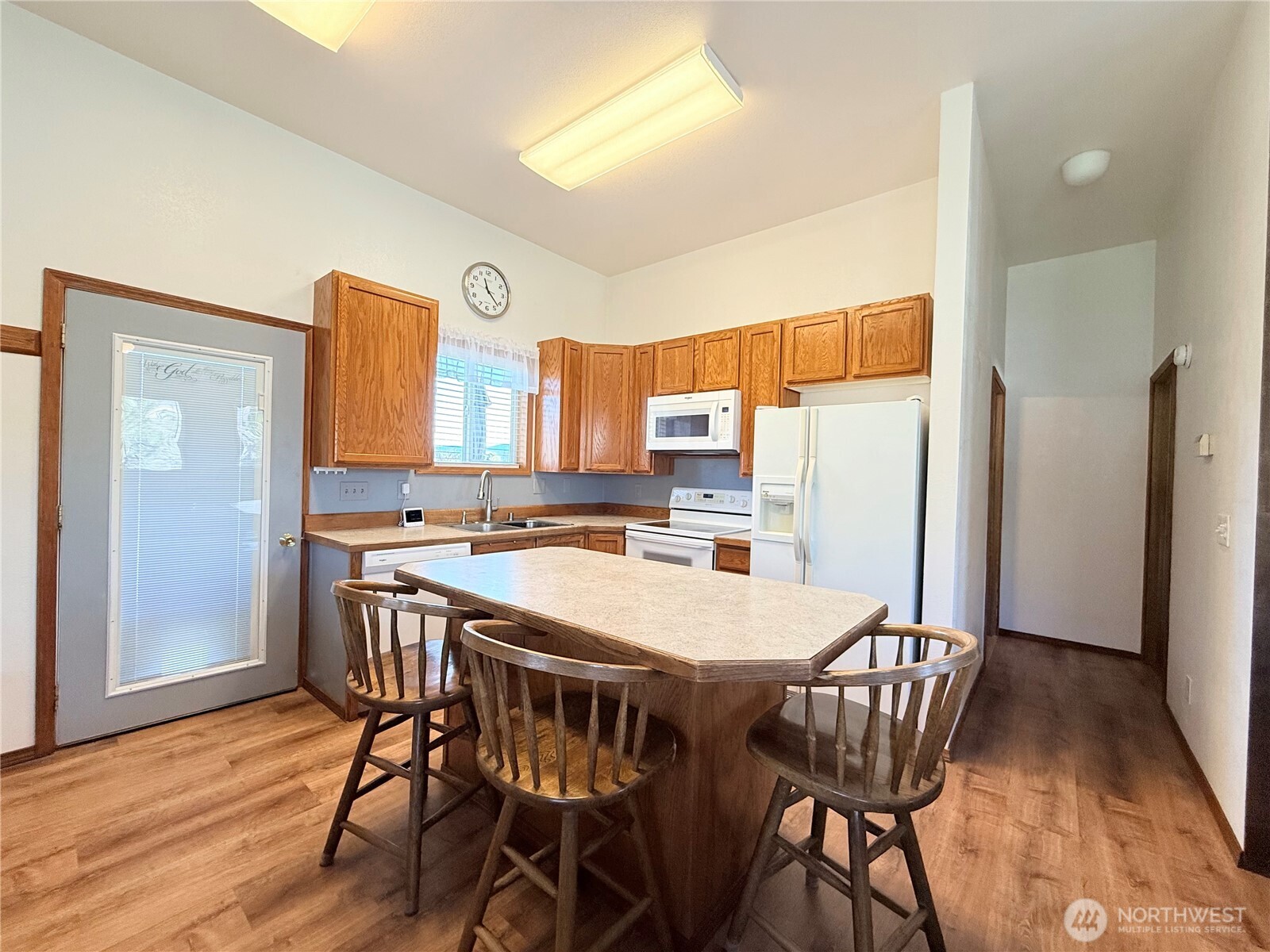 63 Shumway Road Omak, WA 98841 - Photo 11 of 39 a view of a dining room with furniture and wooden floor