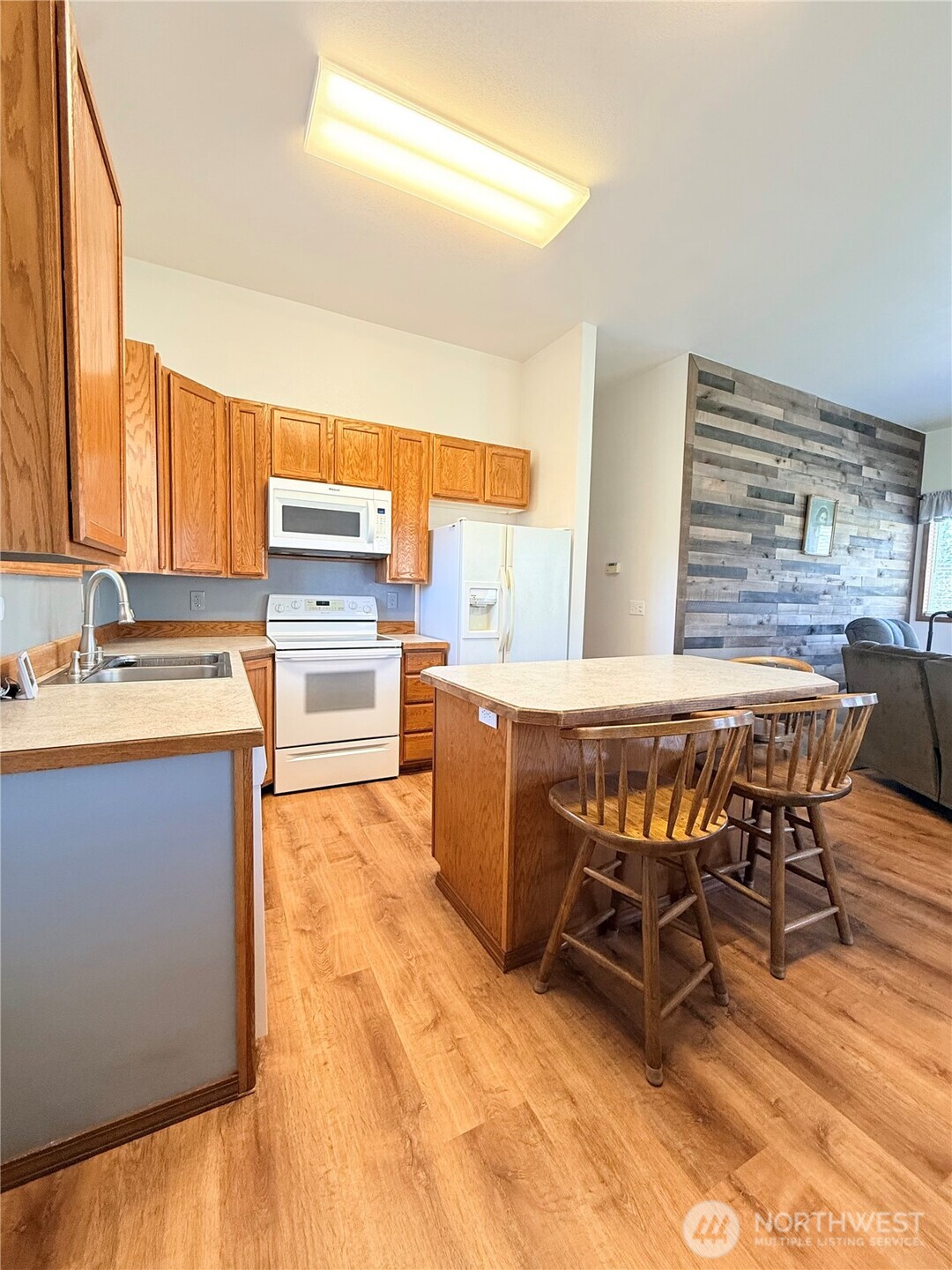 63 Shumway Road Omak, WA 98841 - Photo 12 of 39 a kitchen with a table chairs and a sink