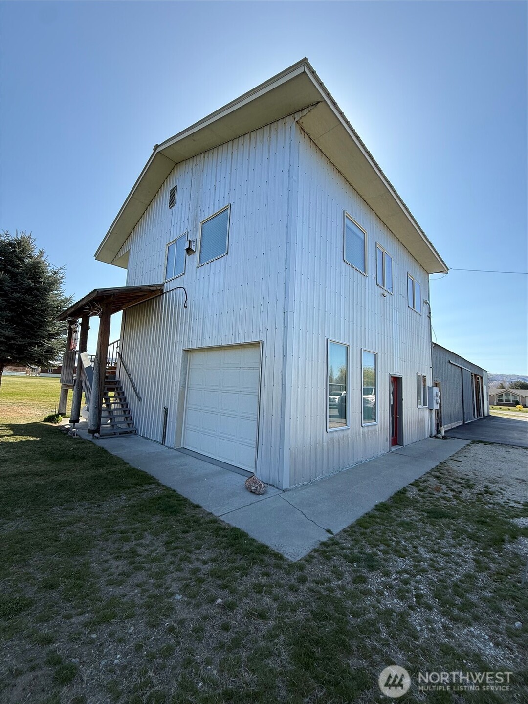 63 Shumway Road Omak, WA 98841 - Photo 34 of 39 a view of a house with backyard and garden