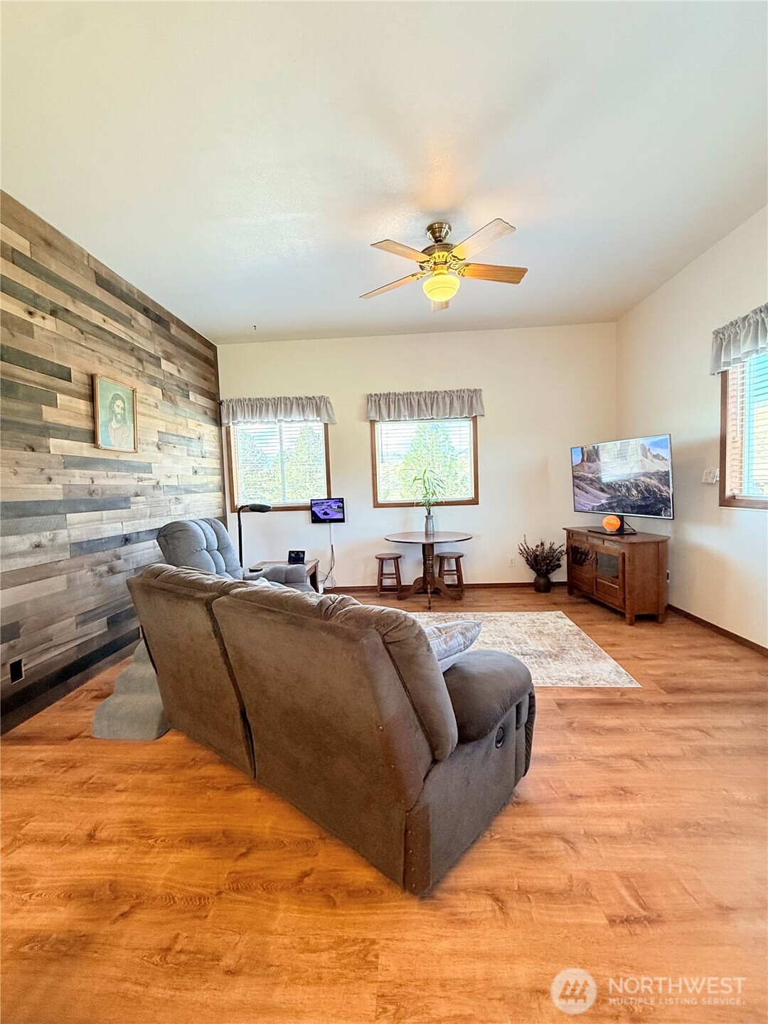 63 Shumway Road Omak, WA 98841 - Photo 5 of 39 a living room with furniture and a flat screen tv