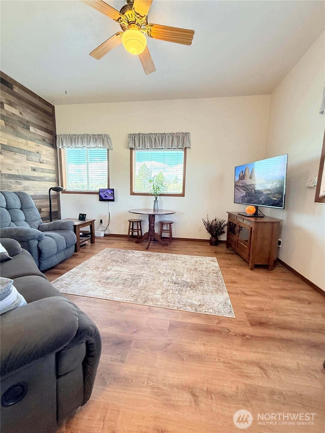 63 Shumway Road Omak, WA 98841 - Photo 6 of 39 a living room with furniture window and a flat screen tv