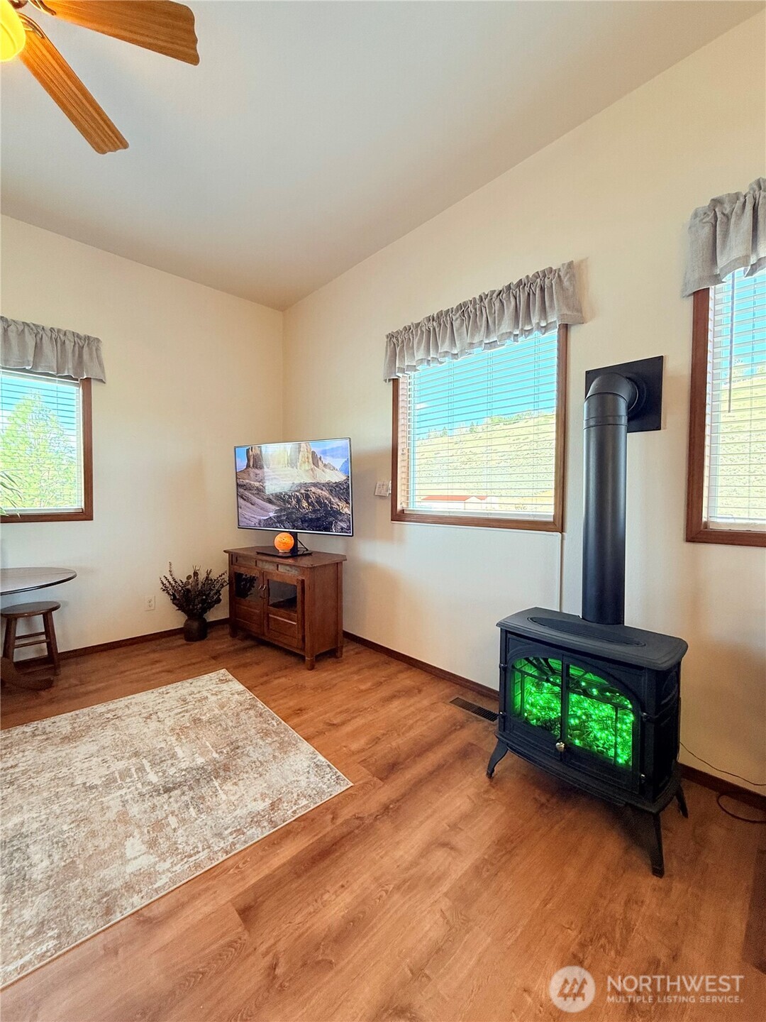 63 Shumway Road Omak, WA 98841 - Photo 7 of 39 a living room with furniture and a window