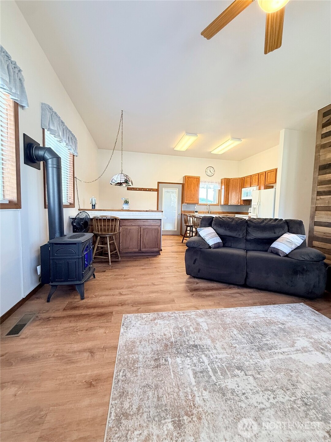 63 Shumway Road Omak, WA 98841 - Photo 8 of 39 a living room with furniture and a chandelier