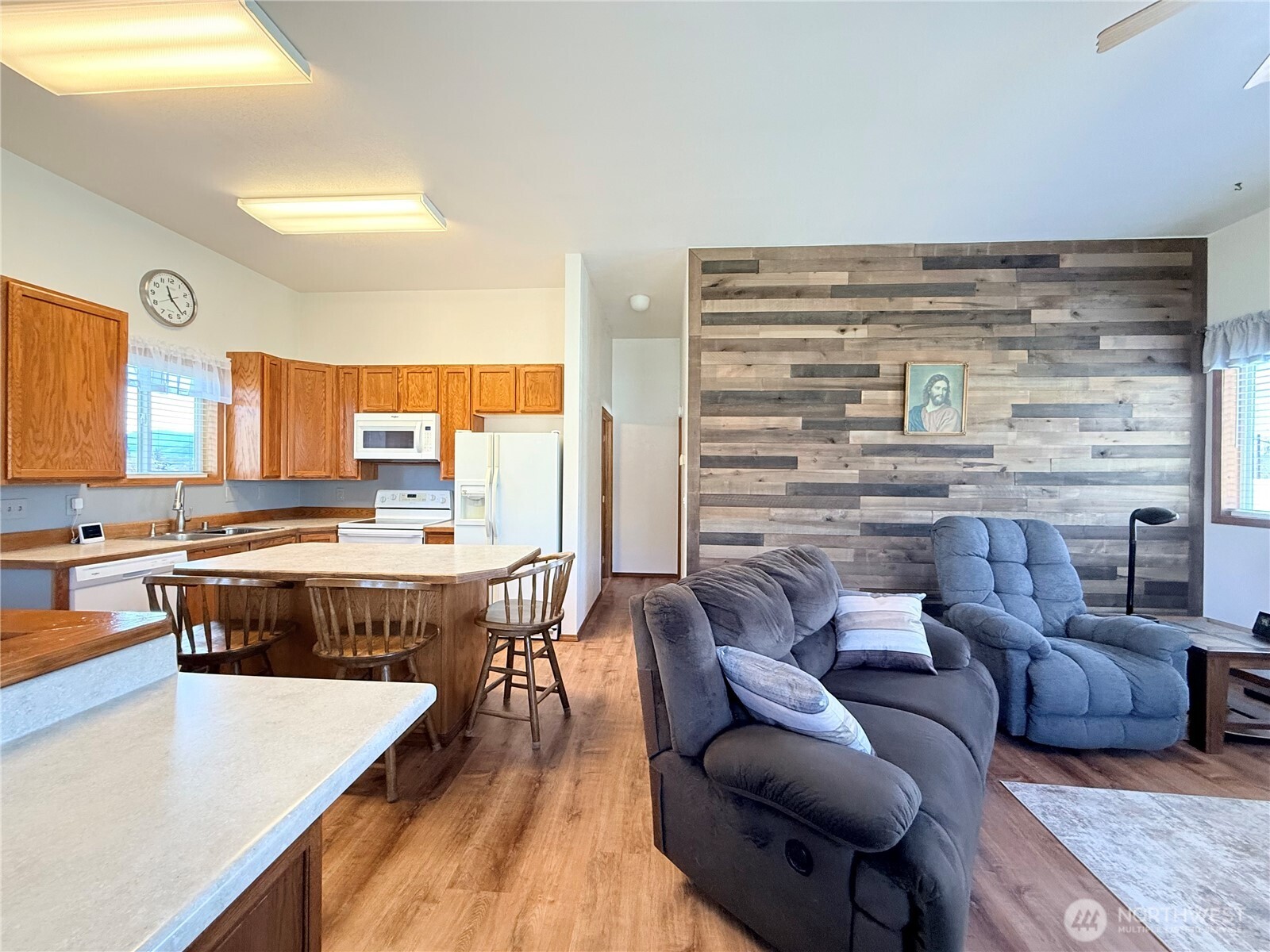 63 Shumway Road Omak, WA 98841 - Photo 9 of 39 a living room with furniture and a kitchen view