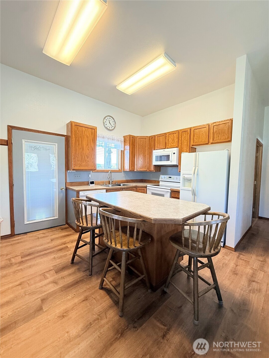 63 Shumway Road Omak, WA 98841 - Photo 10 of 39 a view of a dining room with furniture window and wooden floor