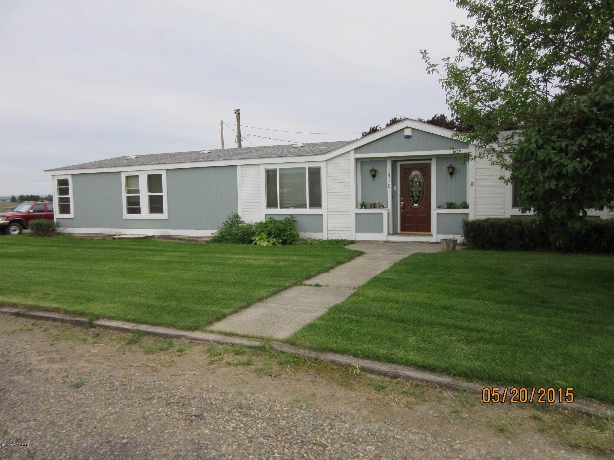 1510 Gurley Road Granger, WA 98932 - Photo 1 of 29 a front view of house with yard and green space