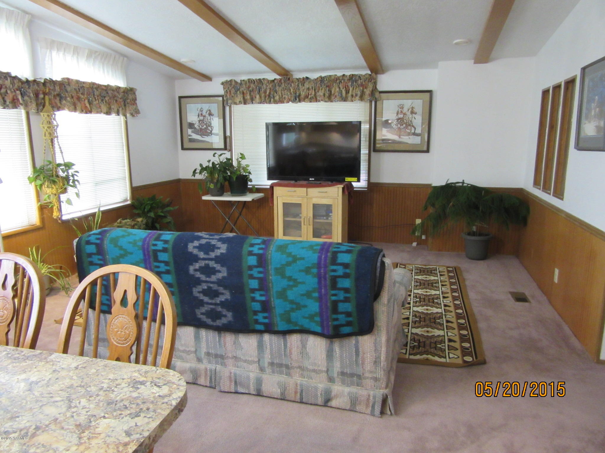 1510 Gurley Road Granger, WA 98932 - Photo 14 of 29 a living room with furniture and a flat screen tv