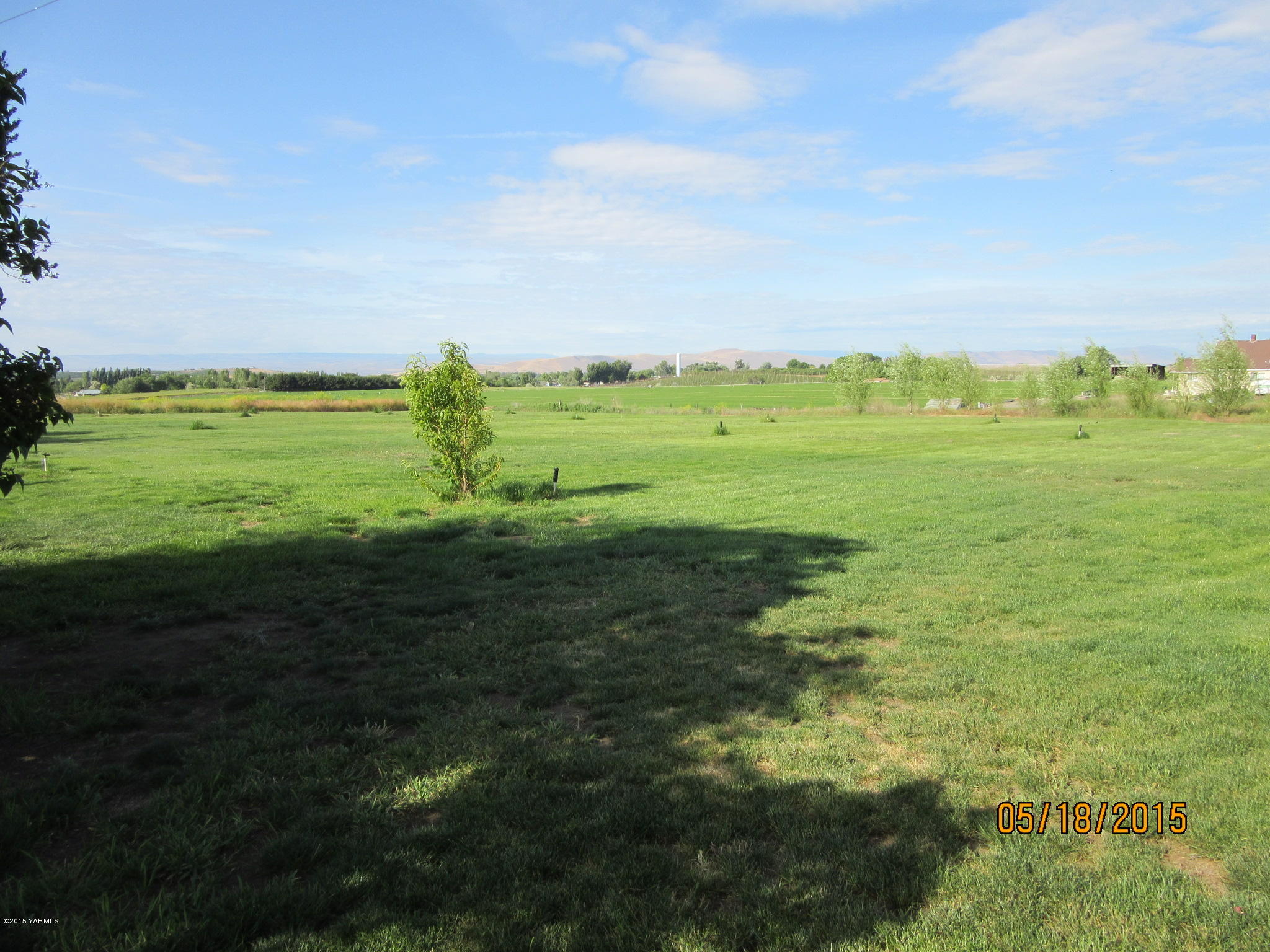 1510 Gurley Road Granger, WA 98932 - Photo 4 of 29 a view of a green field with lots of green space