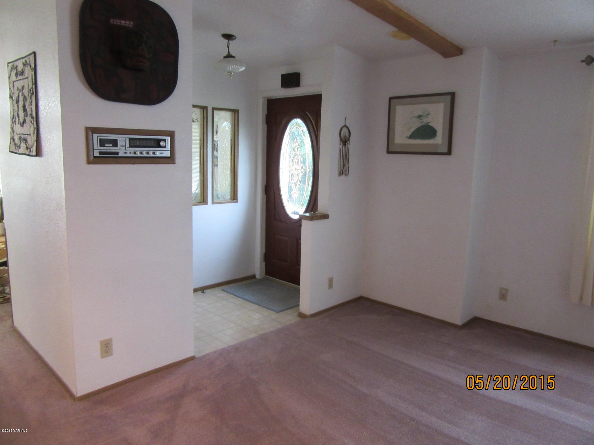 1510 Gurley Road Granger, WA 98932 - Photo 10 of 29 an empty room with wooden floor and windows