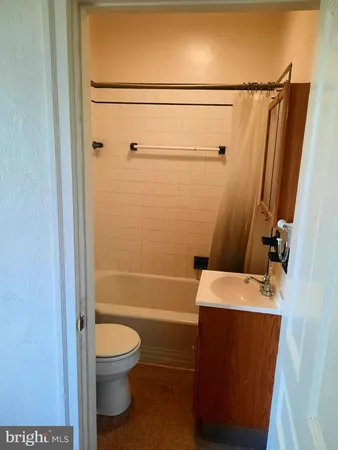 a bathroom with a toilet a sink and a shower