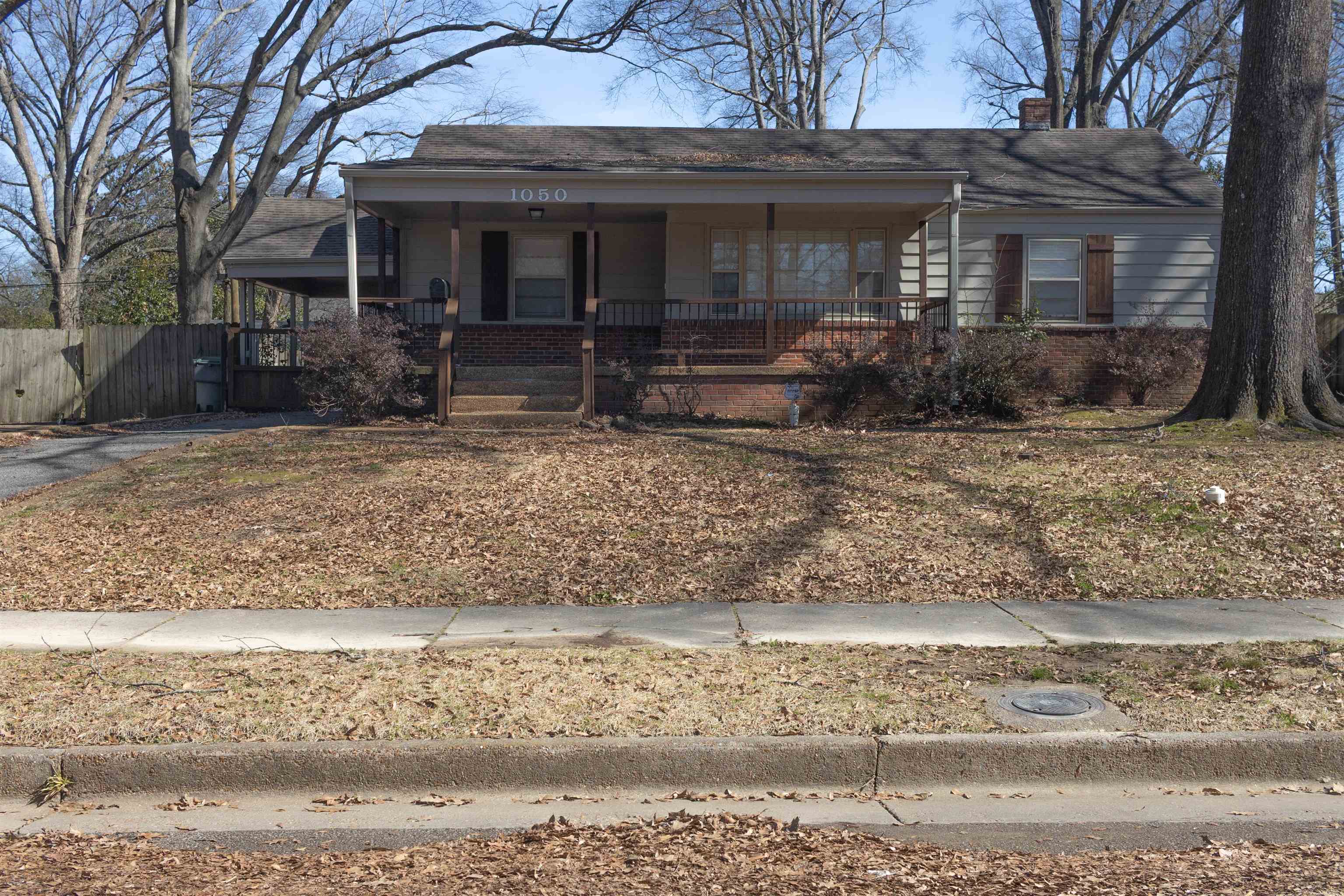 1050 Marcia Road Memphis, TN 38117 - Photo 1 of 20 a front view of a house with garden