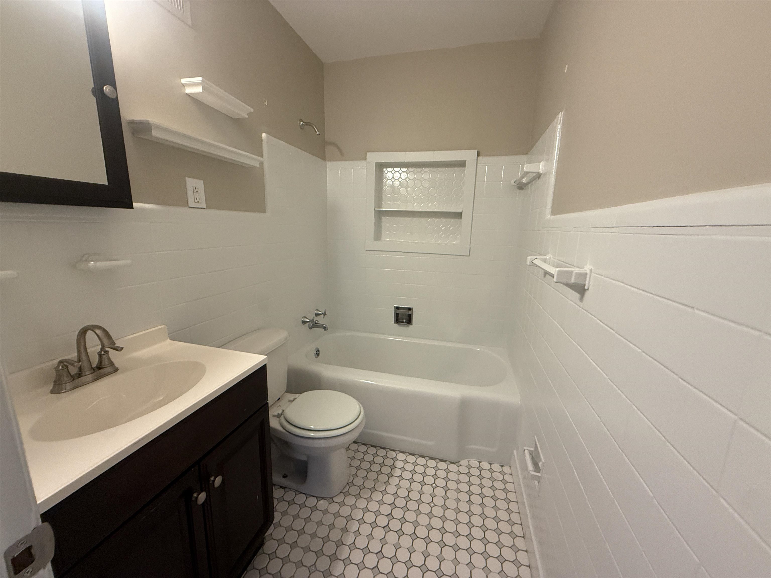 1050 Marcia Road Memphis, TN 38117 - Photo 20 of 20 a bathroom with a sink a toilet and shower