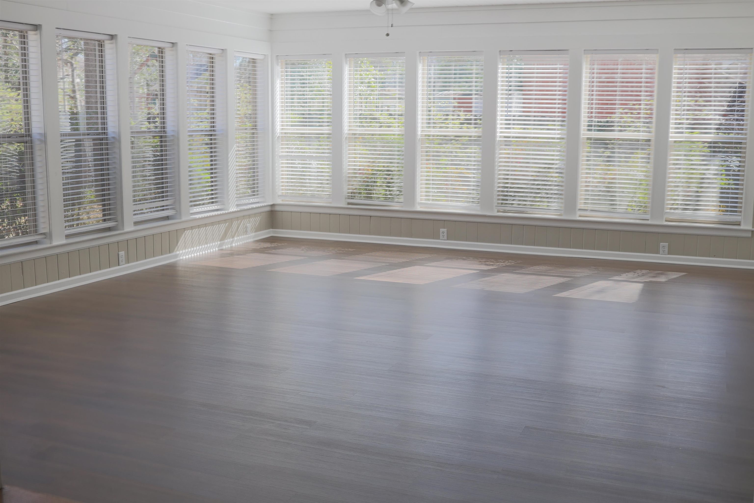 1050 Marcia Road Memphis, TN 38117 - Photo 7 of 20 a view of empty room with wooden floor and fan