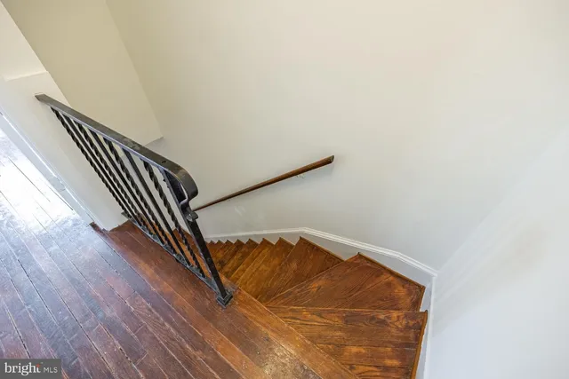 a view of wooden floor with staircase