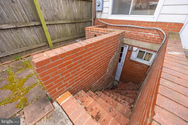 a view of a backyard with sitting area