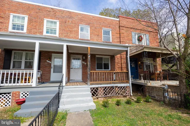 a front view of a house with a porch