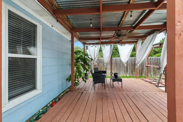 a view of porch with wooden floor