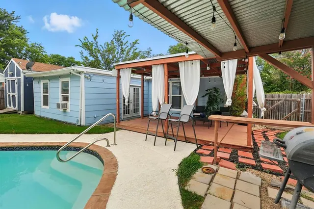 a house view with a seating space and garden