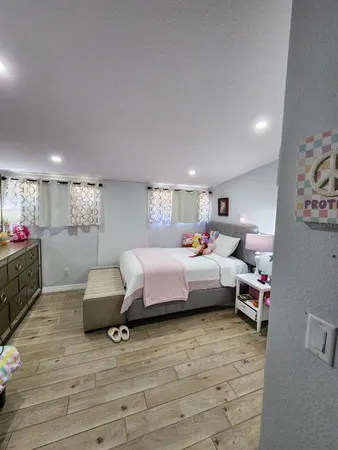 a bedroom with furniture and a bed