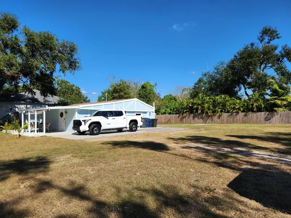 a view of a car park next to a yard