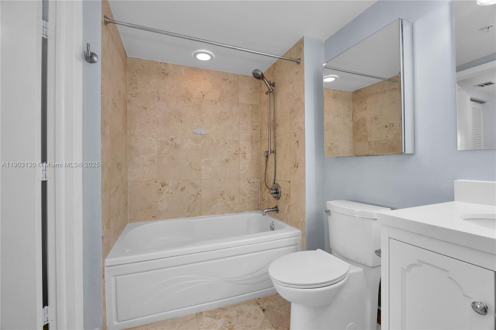 41 Southeast 5th Street, Unit 1515 Miami, FL 33131 - Photo 22 of 25 a bathroom with a sink toilet and shower