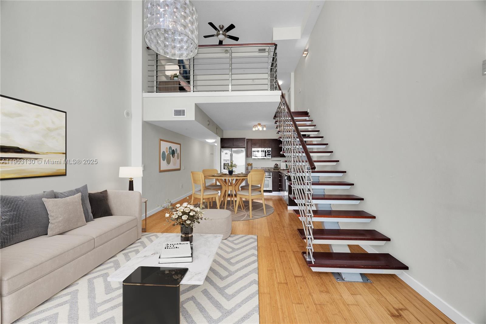 41 Southeast 5th Street, Unit 1515 Miami, FL 33131 - Photo 5 of 25 a view of a living room with furniture and wooden floor