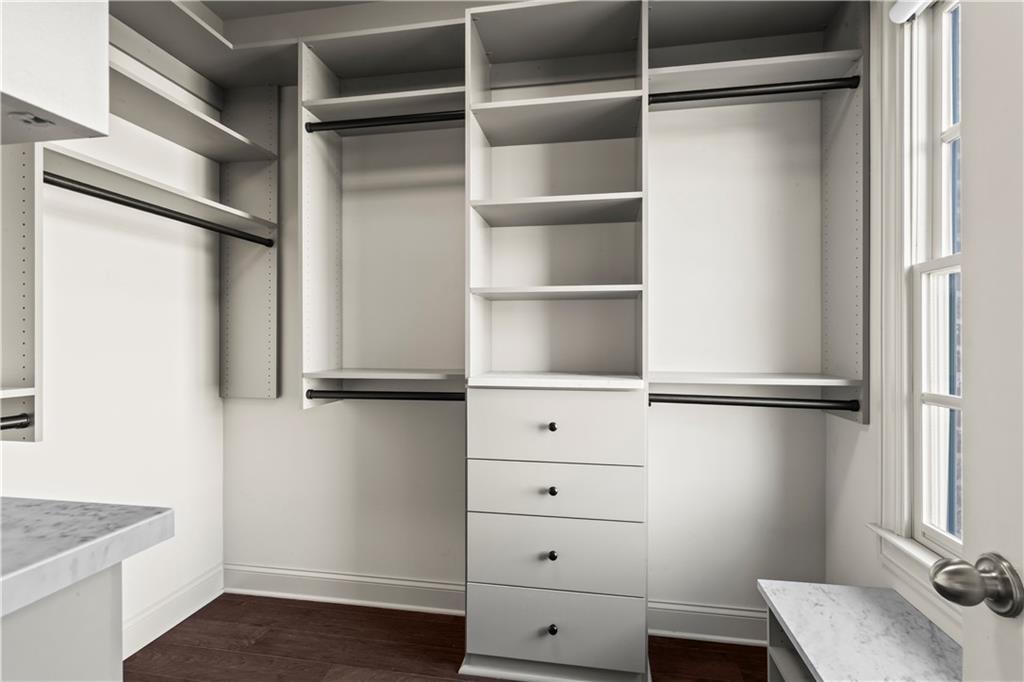 1892 Skyfall Circle Brookhaven, GA 30319 - Photo 15 of 24 a view of walk in closet with empty racks