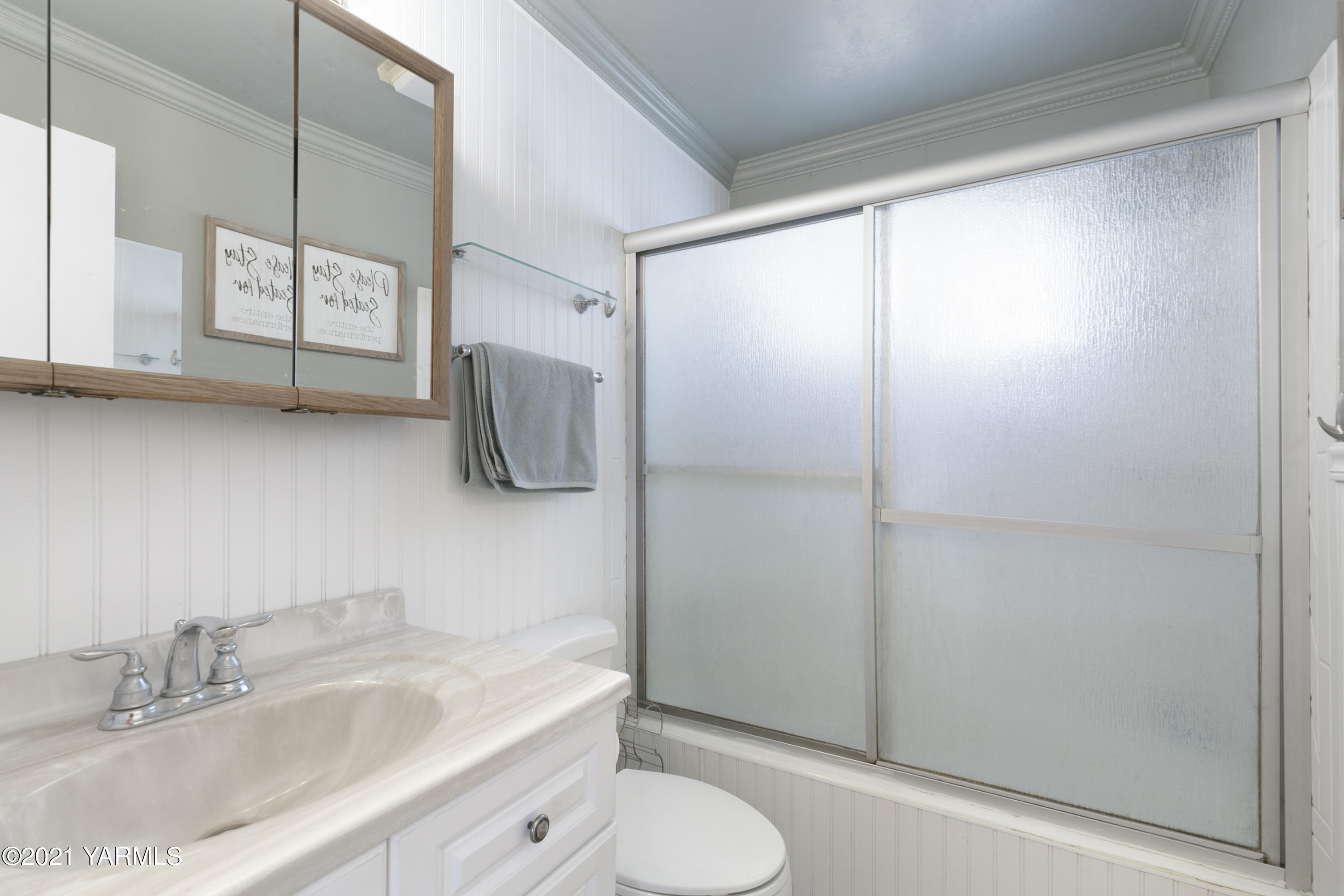 1111 Deeringhoff Road Moxee, WA 98936 - Photo 14 of 18 a bathroom with a granite countertop sink a toilet and shower