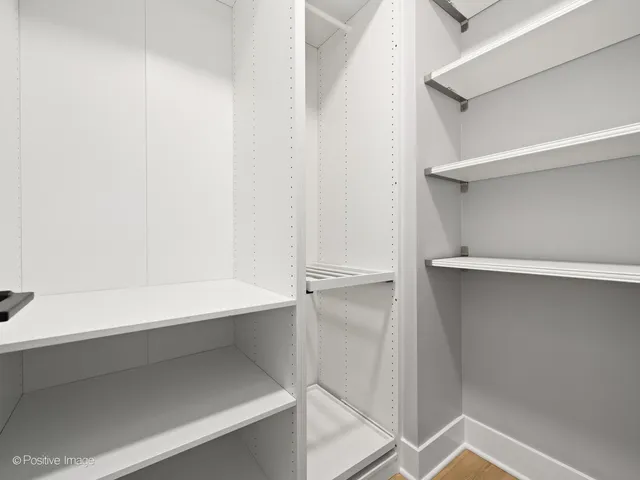 a view of an empty walk in closet