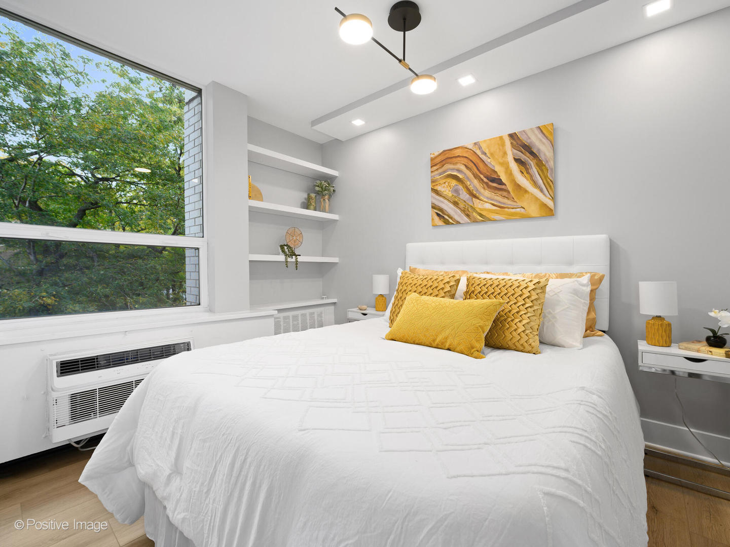 1455 North Sandburg Terrace, Unit 209B Chicago, IL 60610 - Photo 16 of 33 a bedroom with a bed and a large window