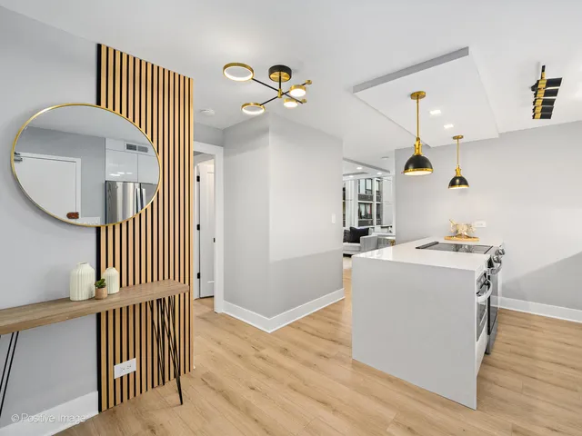 a view of a livingroom with furniture and hardwood floor