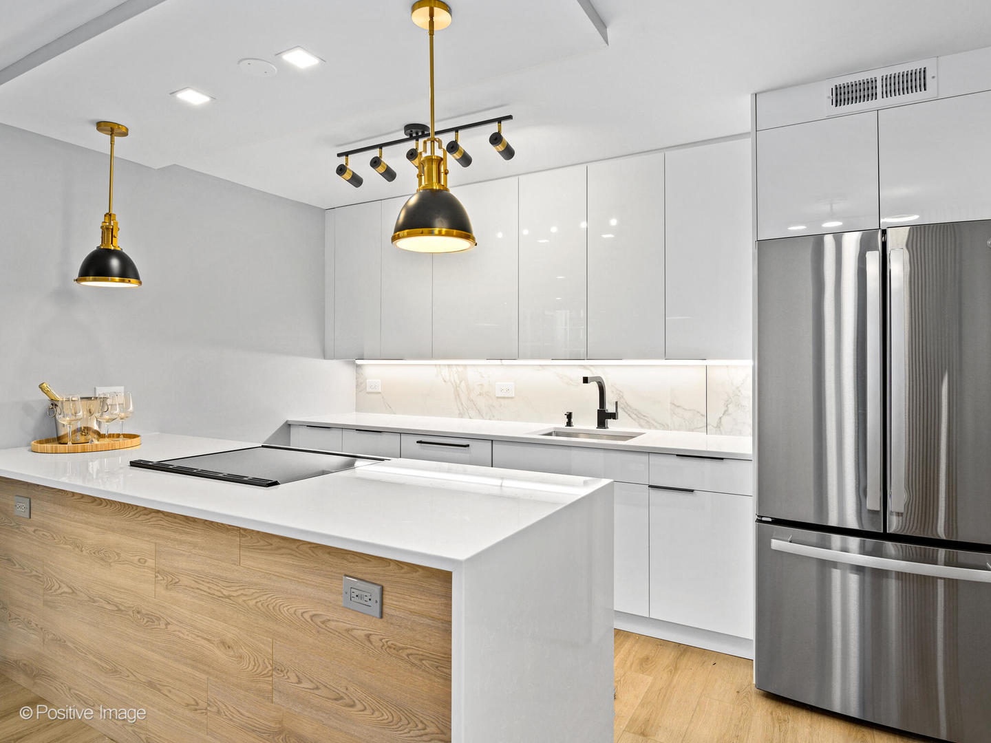 1455 North Sandburg Terrace, Unit 209B Chicago, IL 60610 - Photo 3 of 33 a kitchen with a sink a refrigerator and window