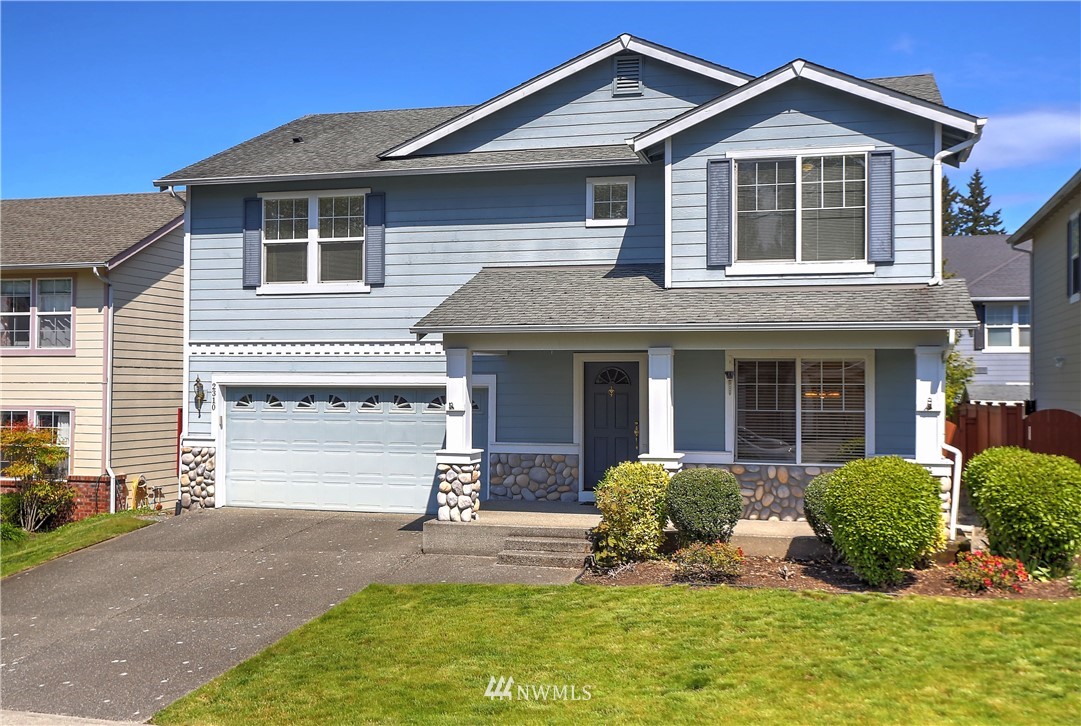 2310 Southeast 3rd Street Renton, WA 98056 - Photo 1 of 30 a front view of a house with a yard and porch