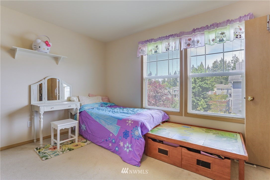 2310 Southeast 3rd Street Renton, WA 98056 - Photo 15 of 30 a room with a bed and a window