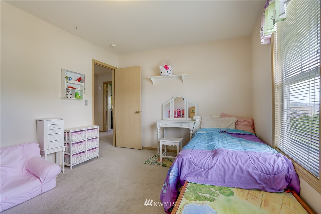 2310 Southeast 3rd Street Renton, WA 98056 - Photo 16 of 30 a bedroom with a bed and a workspace