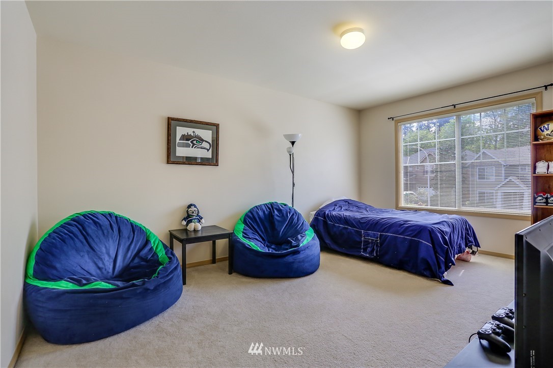 2310 Southeast 3rd Street Renton, WA 98056 - Photo 17 of 30 a living room with a couch and a potted plant