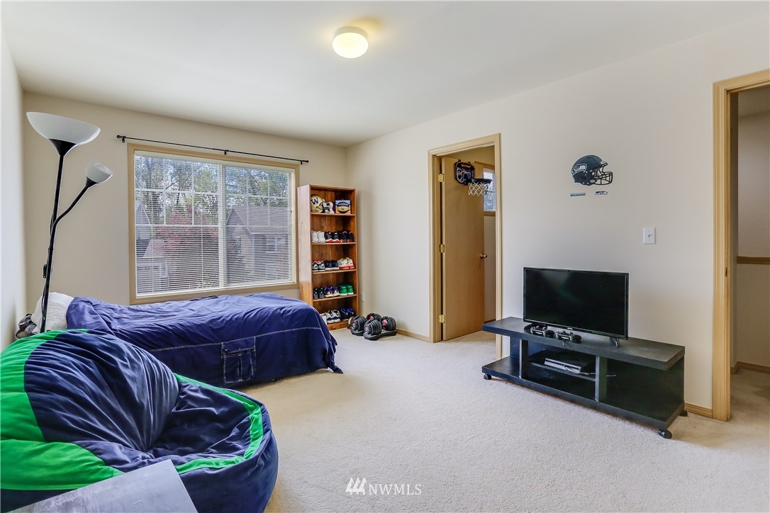2310 Southeast 3rd Street Renton, WA 98056 - Photo 18 of 30 a living room with furniture and a flat screen tv