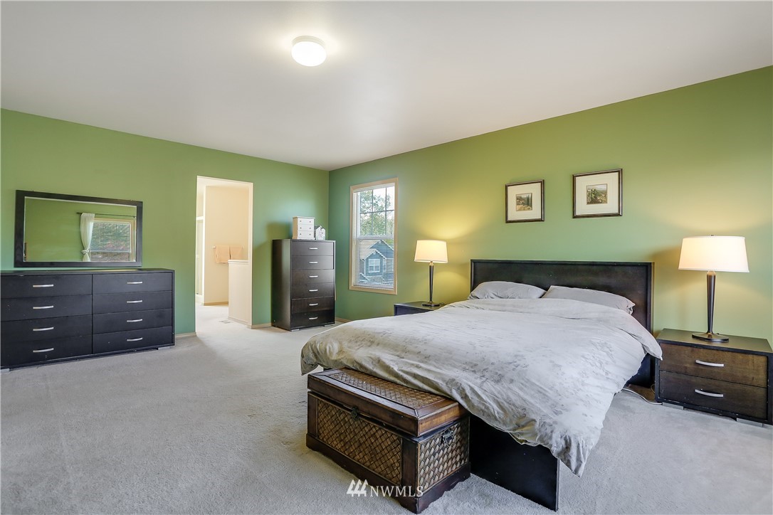2310 Southeast 3rd Street Renton, WA 98056 - Photo 21 of 30 a spacious bedroom with a bed and a dresser