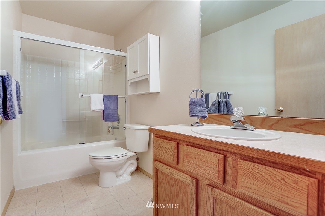 2310 Southeast 3rd Street Renton, WA 98056 - Photo 24 of 30 a bathroom with a sink toilet and shower
