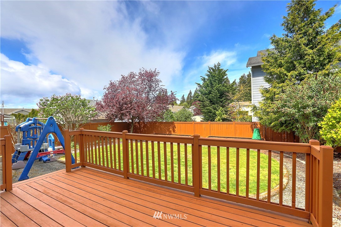 2310 Southeast 3rd Street Renton, WA 98056 - Photo 25 of 30 a view of a balcony with wooden floor and fence