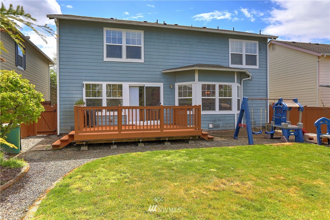2310 Southeast 3rd Street Renton, WA 98056 - Photo 27 of 30 a backyard of a house with barbeque oven and garden