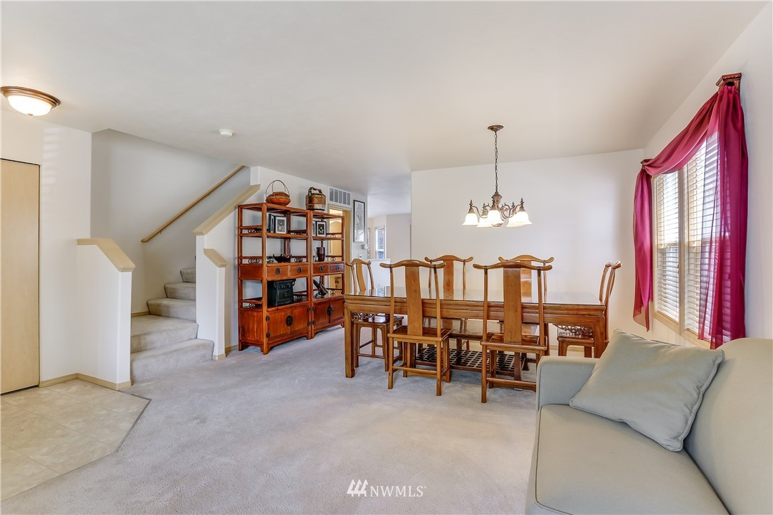 2310 Southeast 3rd Street Renton, WA 98056 - Photo 5 of 30 a living room with furniture and a chandelier