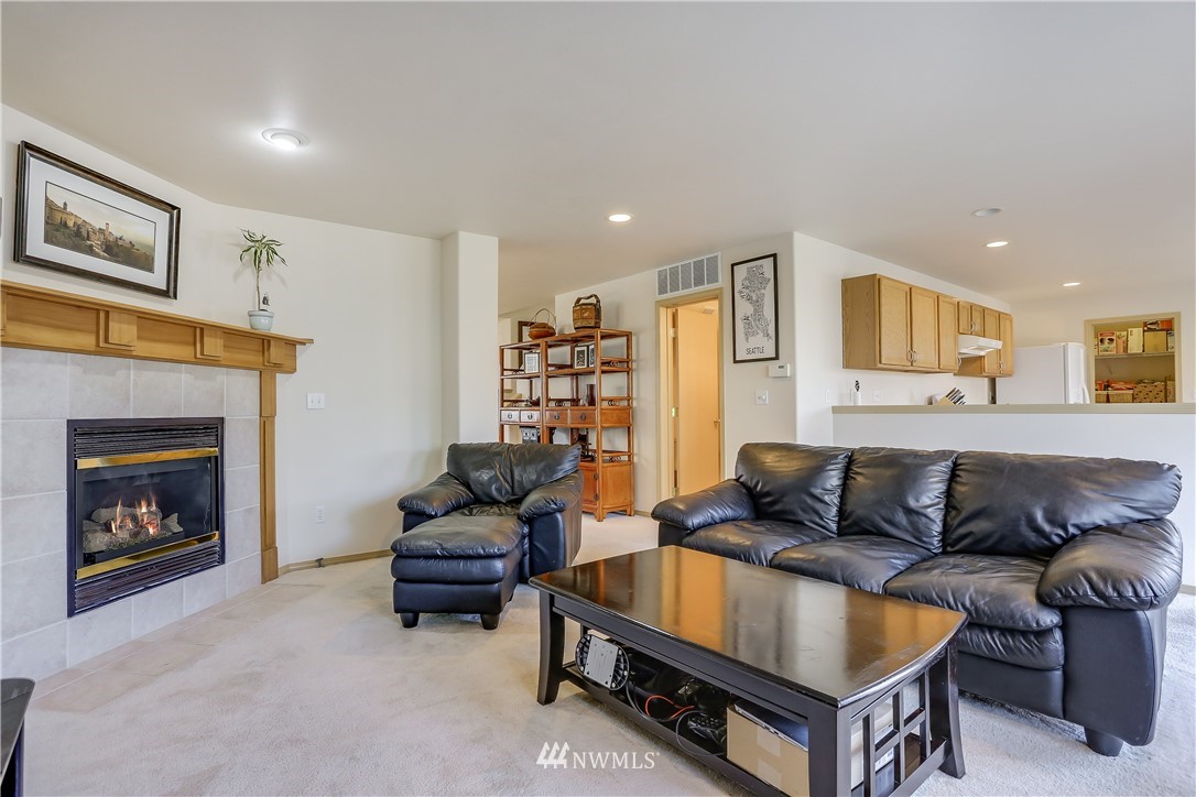2310 Southeast 3rd Street Renton, WA 98056 - Photo 7 of 30 a living room with furniture and a fireplace