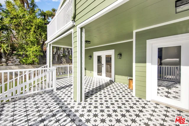 a balcony view with a glass door